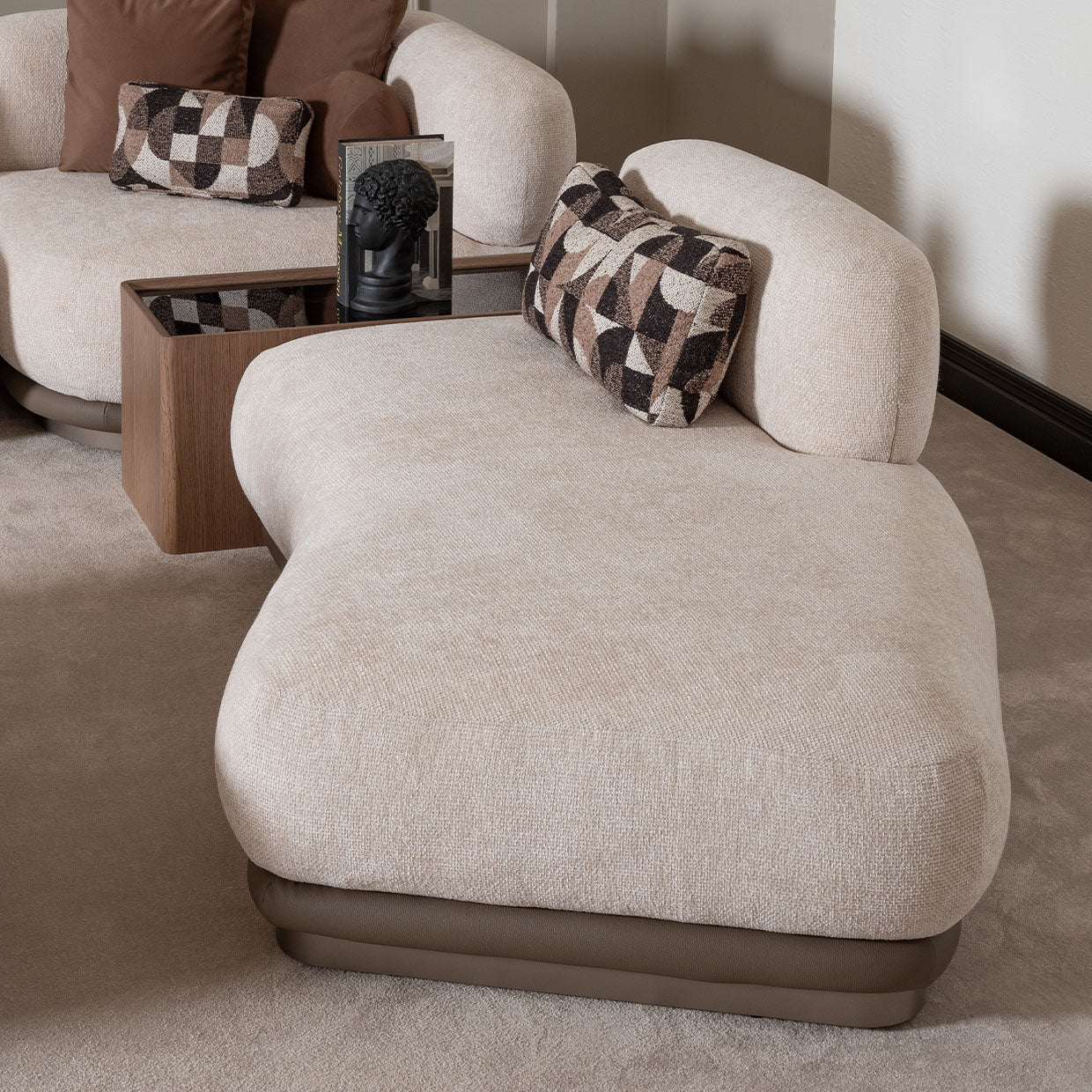 Close-up of the Bristol Point chaise and adjacent sectional table included in the six-piece set; decorative accessories not included.